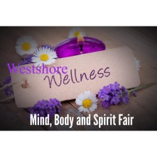 Flowers a candle and the message Westshore Wellness Mind, Body & Spirit Fair