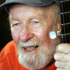 Seeger, sings, this land is your land, Woody, Guthrie,